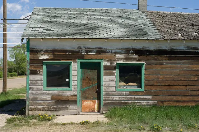Weathered old storefront with green trim